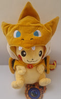 Front view of Pikachu plush wearing removable Charizard-style costume
