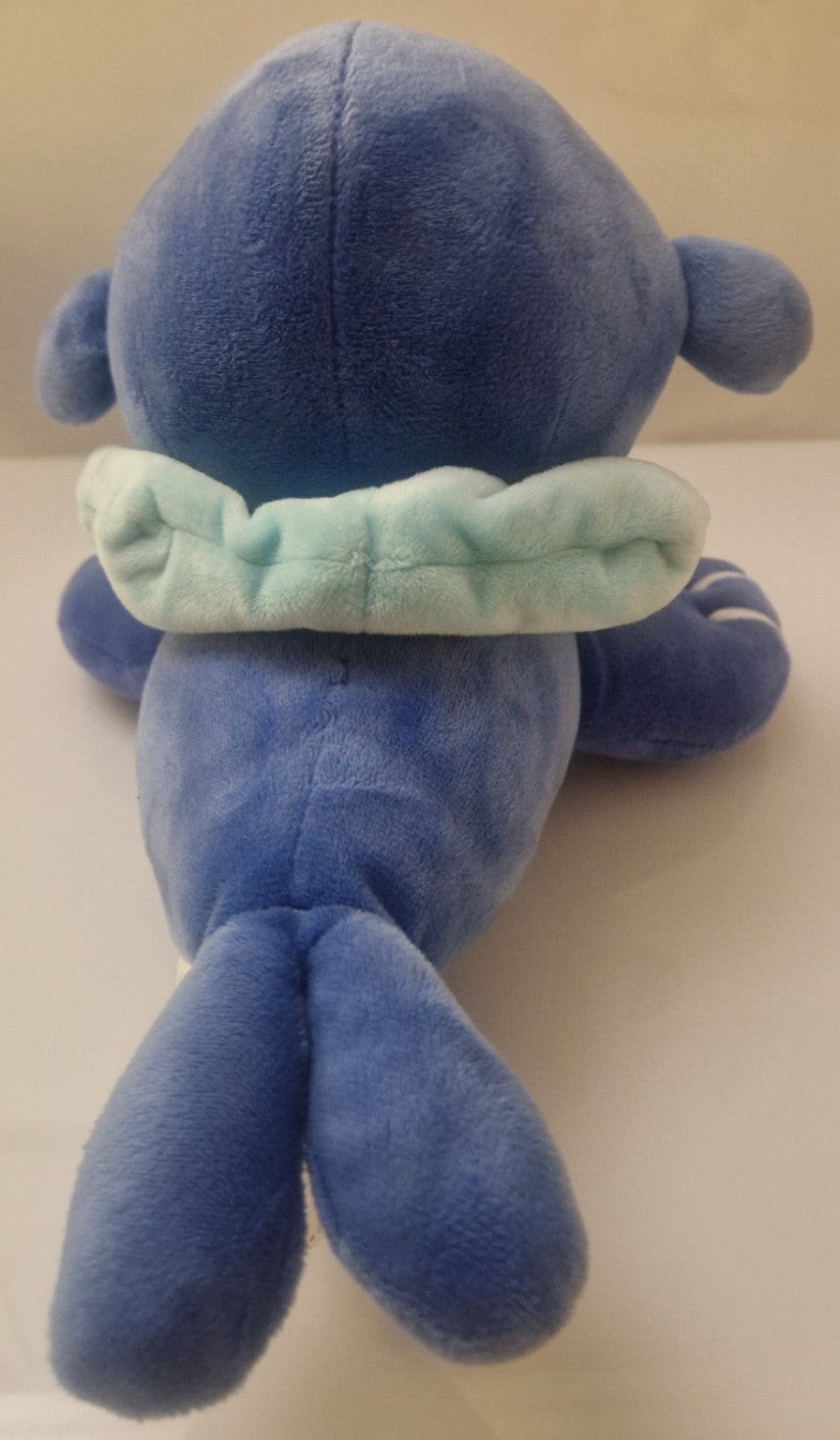Rear view of official Pokémon Popplio plush soft toy