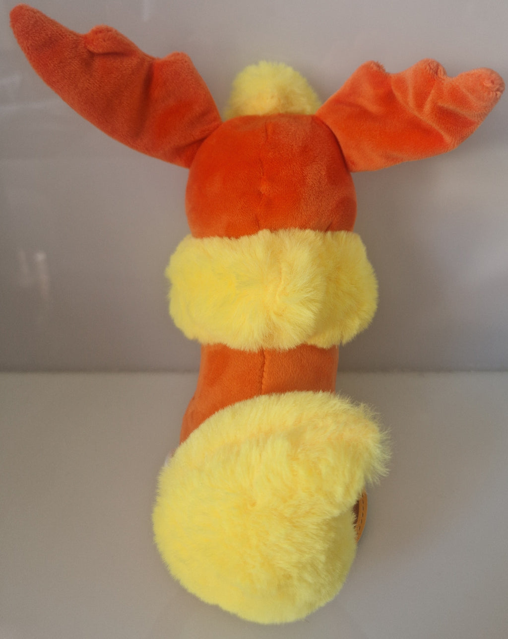 Rear view of Pokémon Flareon plush soft toy