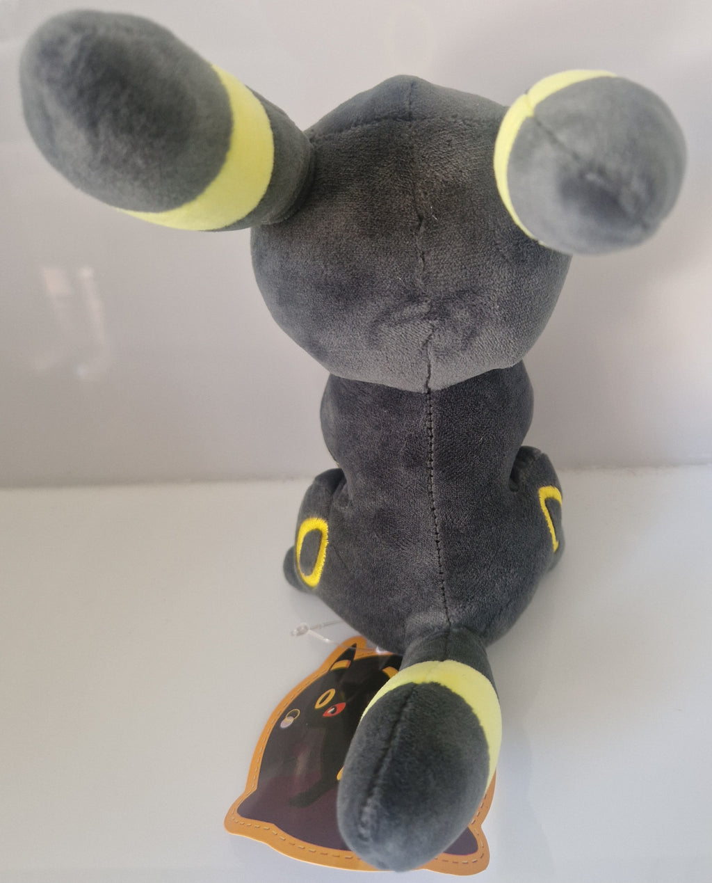 Rear view of Pokémon Umbreon plush soft toy