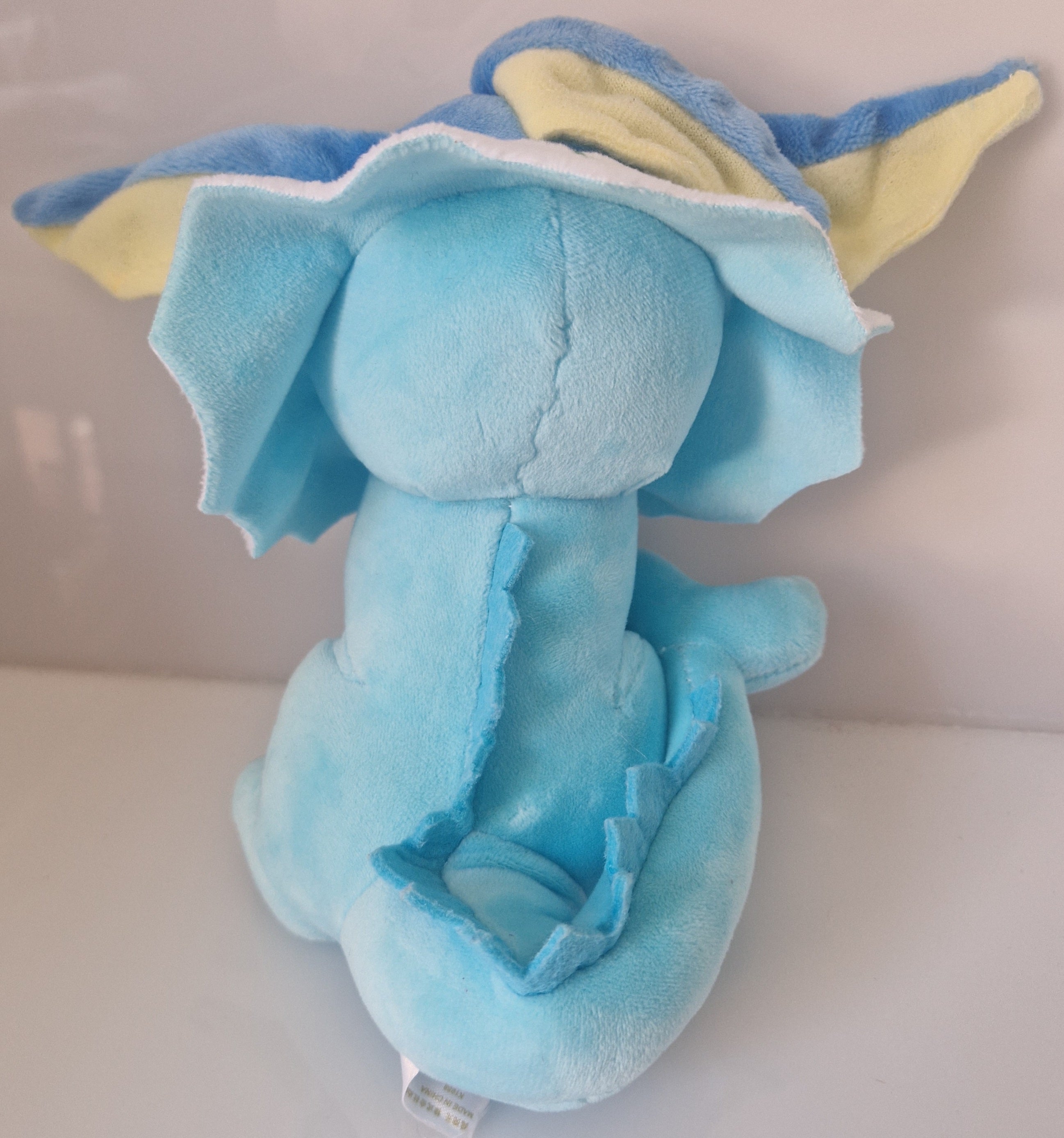 Rear view of Pokémon Vaporeon plush soft toy