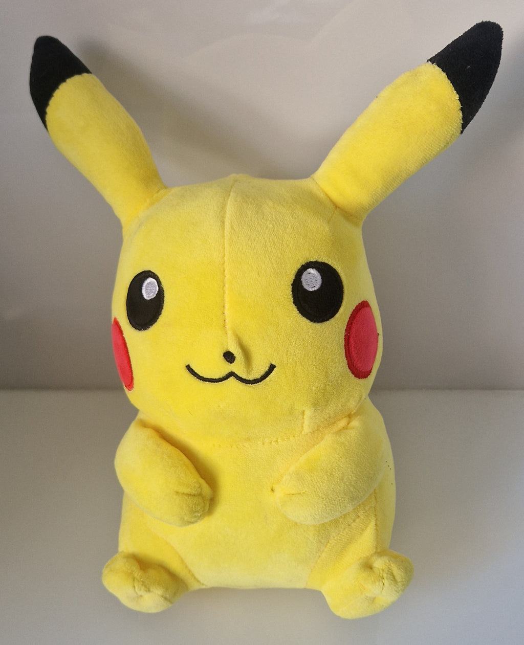 Front view of Pokémon Pikachu plush soft toy