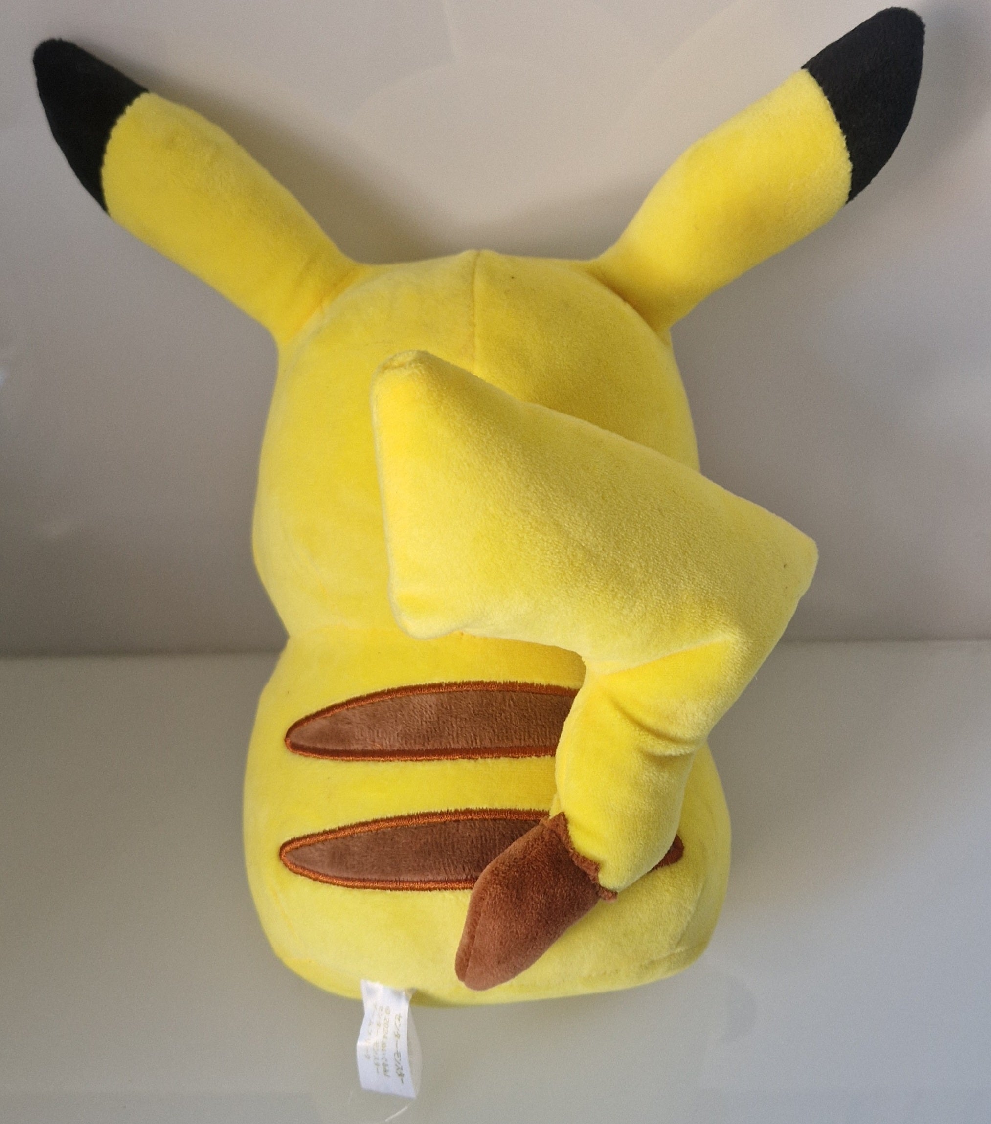 Rear view of Pokémon Pikachu plush soft toy