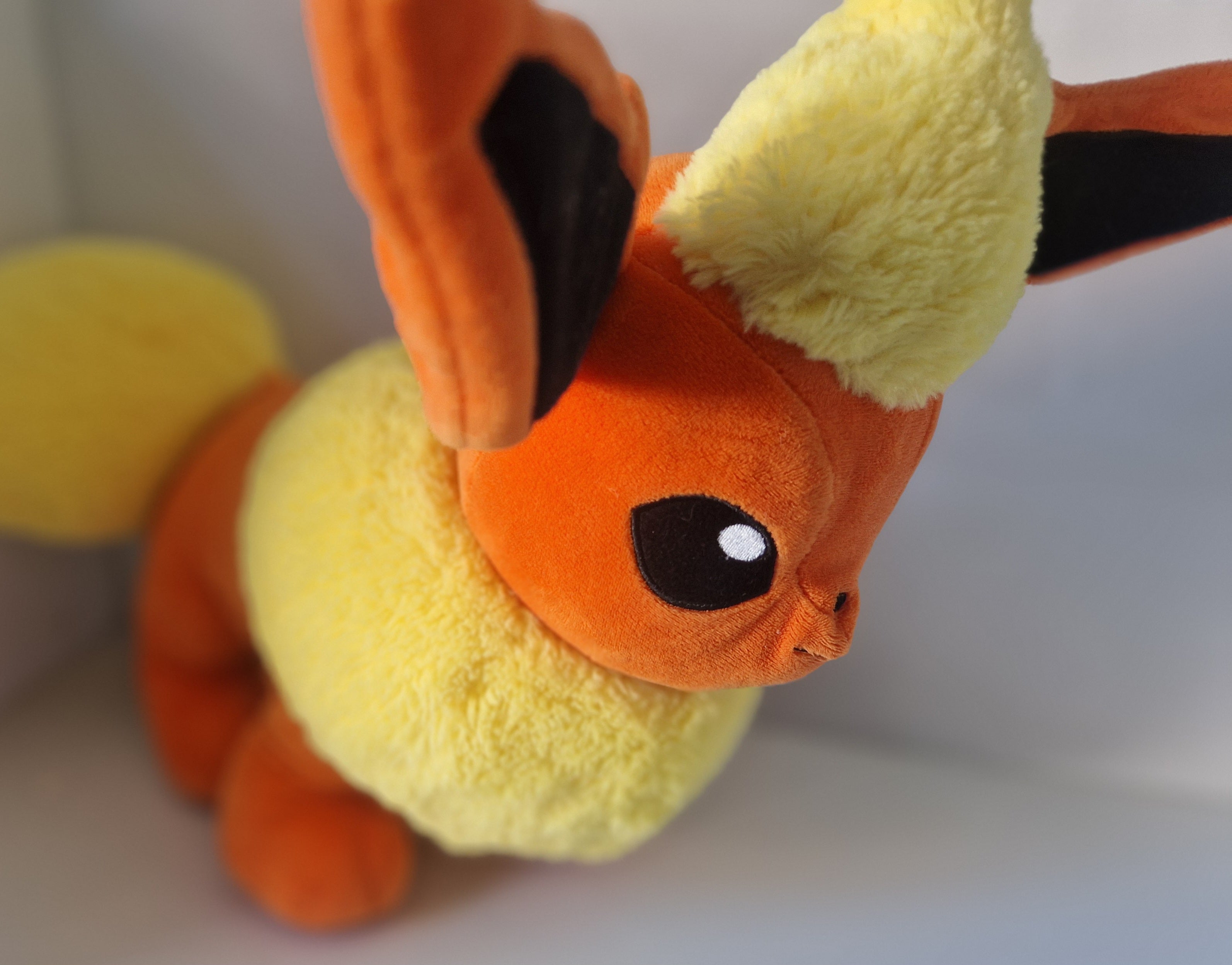 Opposite side view of official Pokémon Flareon Build-A-Bear Workshop plush
