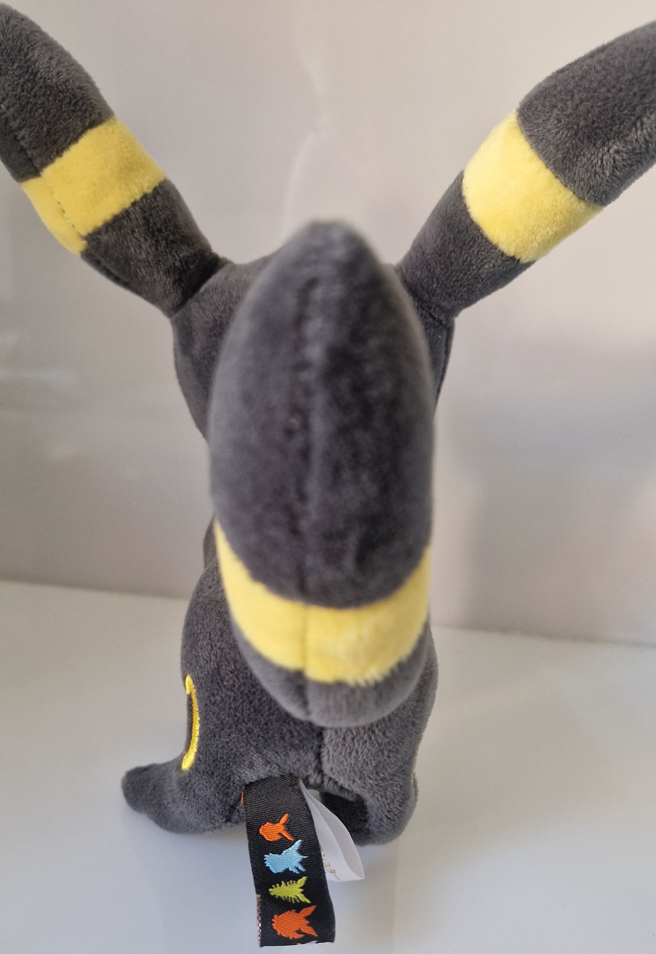 Rear view of official Pokémon Umbreon plush soft toy