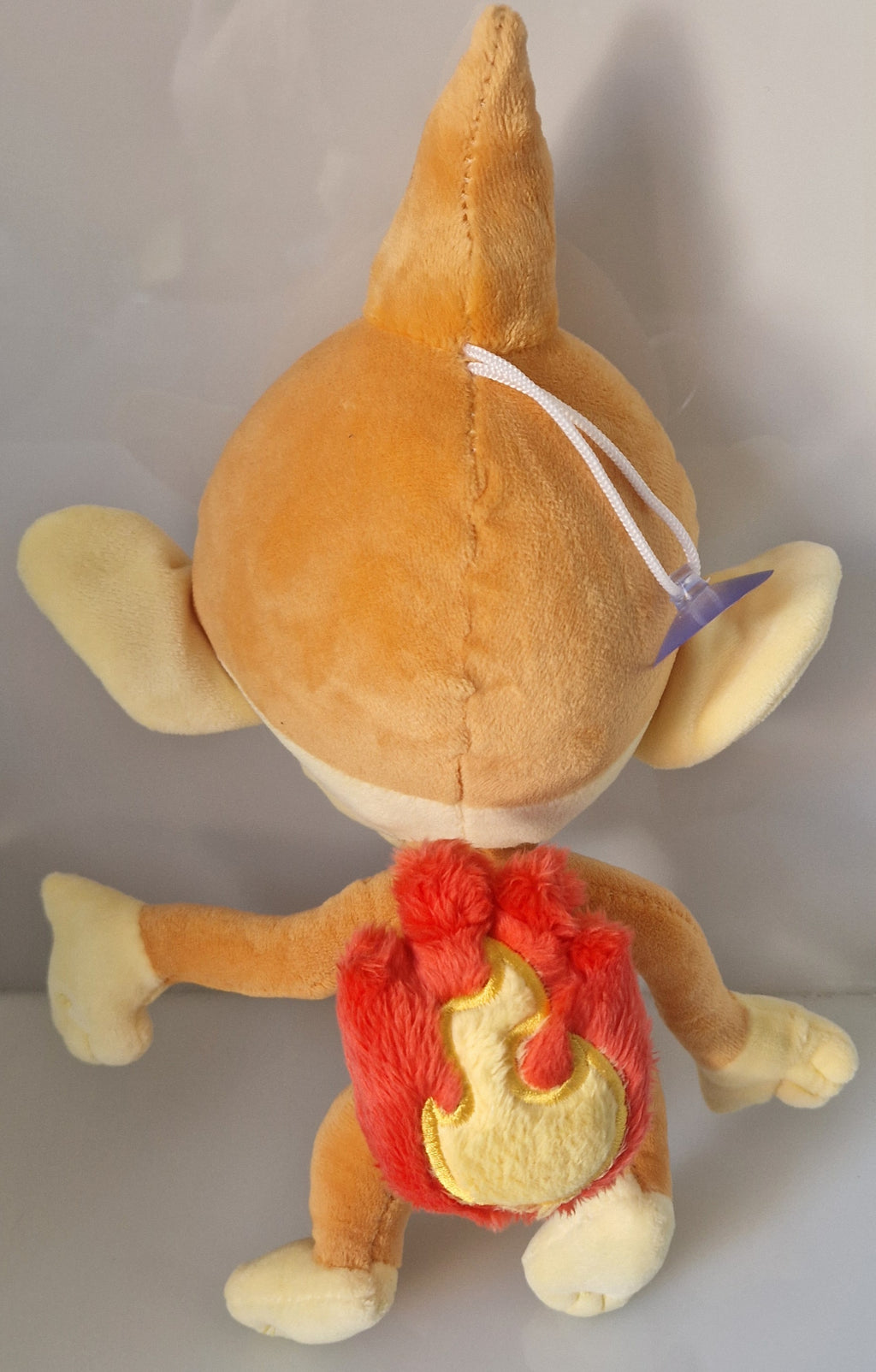 Rear view of Pokémon Chimchar plush soft toy