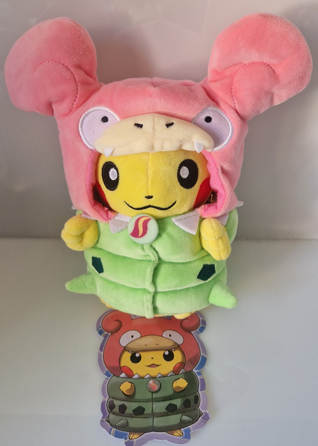 Front view of Pikachu Slowpoke and Tyranitar cosplay plush