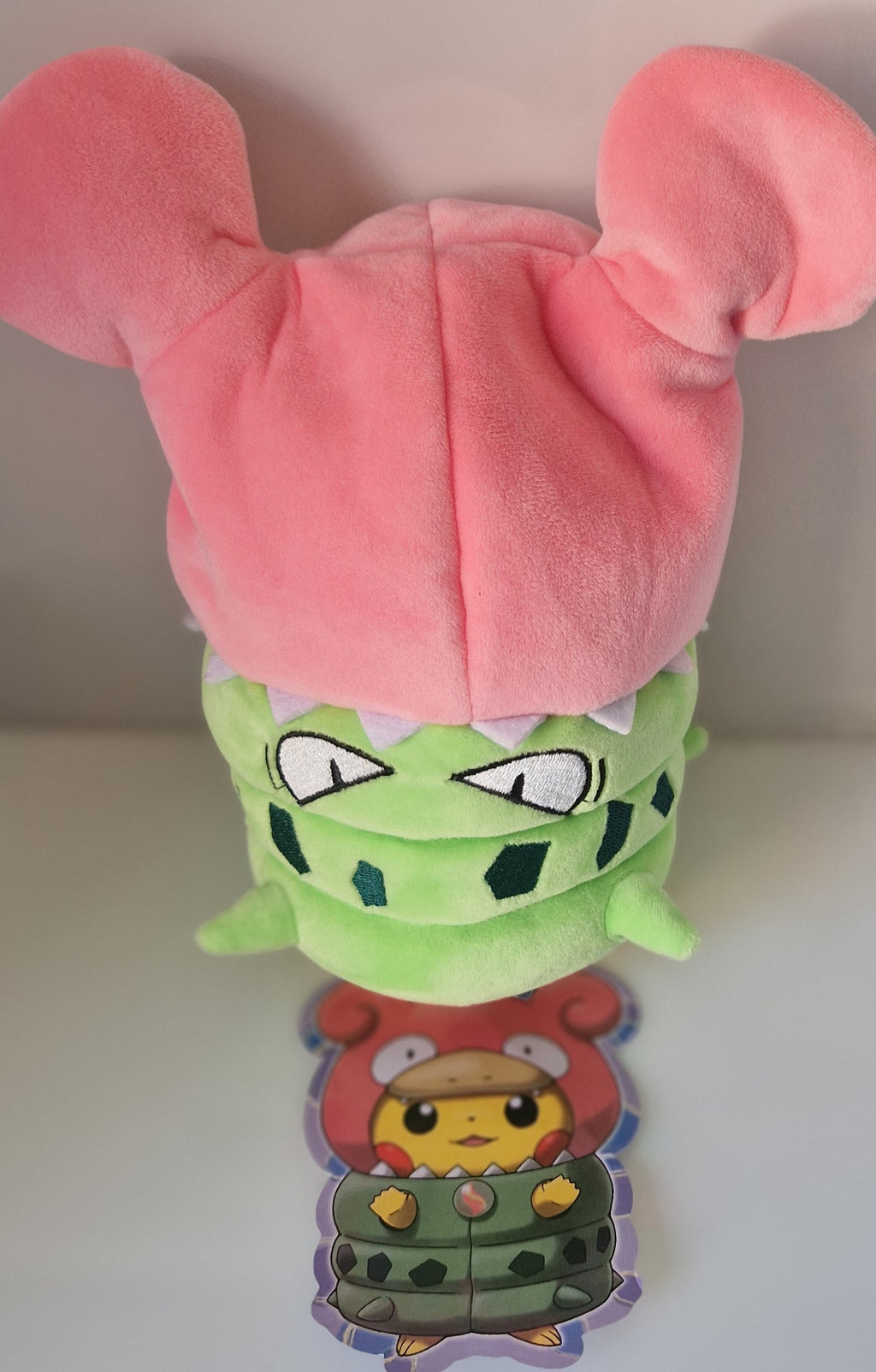 Rear view of Pikachu Slowpoke and Tyranitar cosplay plush