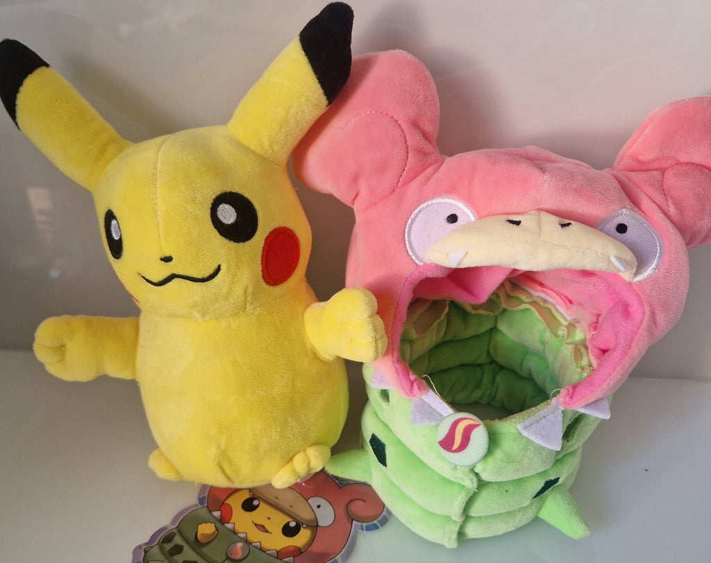 Pikachu plush beside its removable Slowpoke and Tyranitar cosplay costume