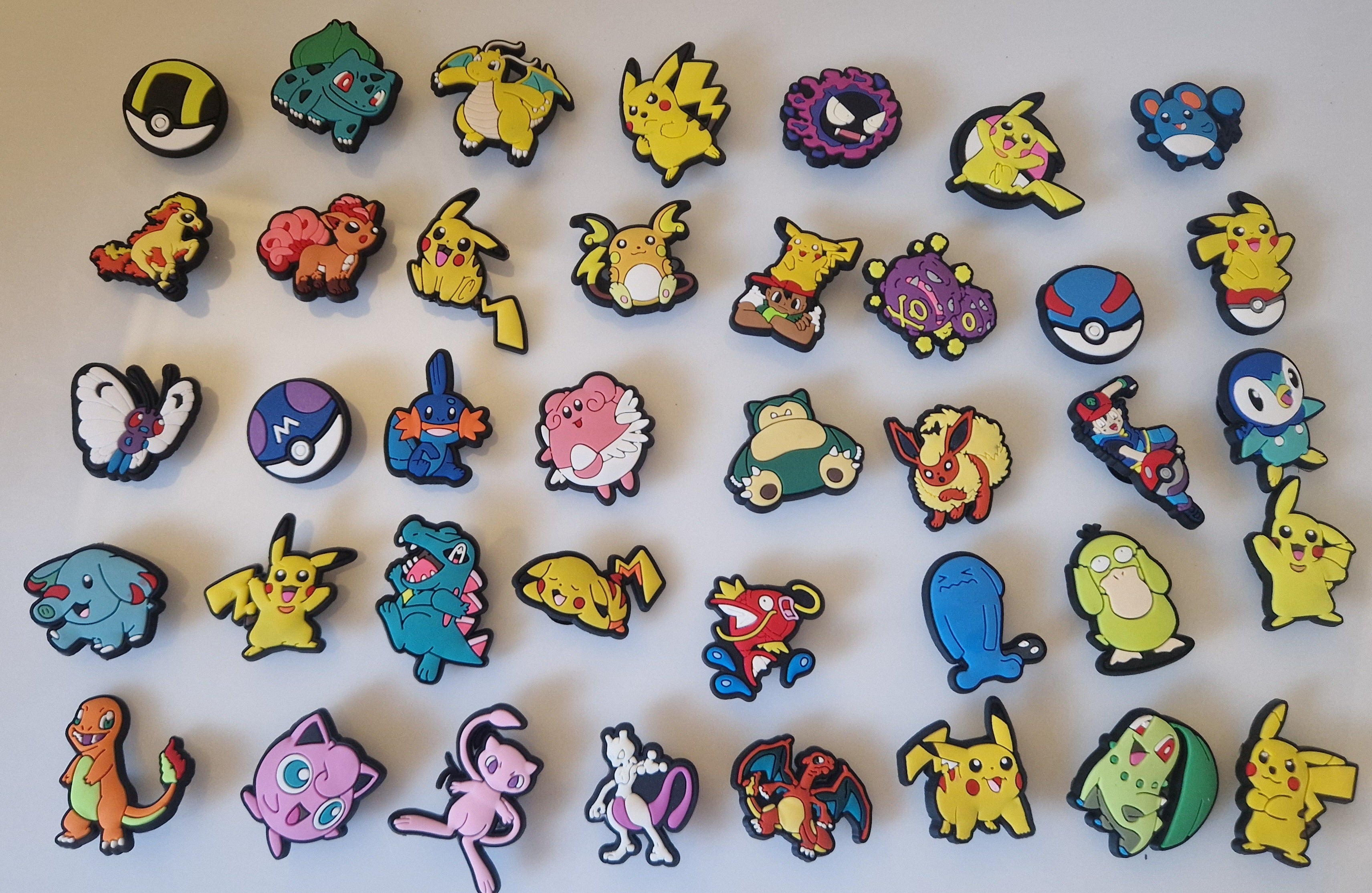 Selection of Pokémon-style shoe charms available in mystery sets